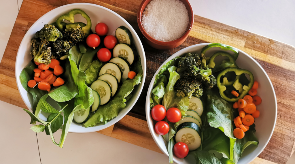 Nutrient dense meal with lettuce greens, broccoli, cucumber, tomatoes
